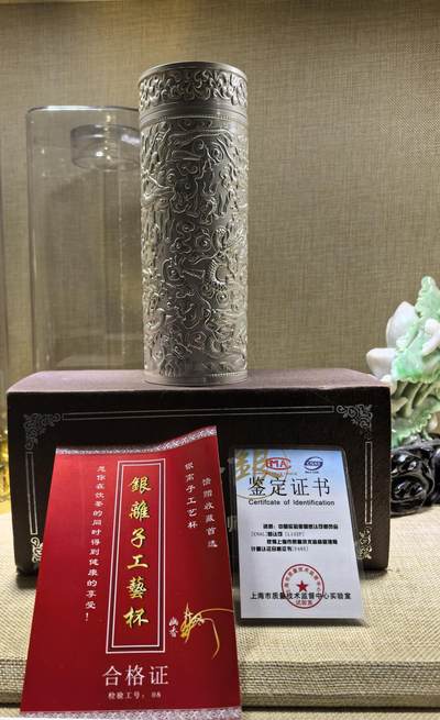 手工簪刻九龙戏珠足银保健杯全新未使用尺寸:18.2*6.6cm克重:545.8g