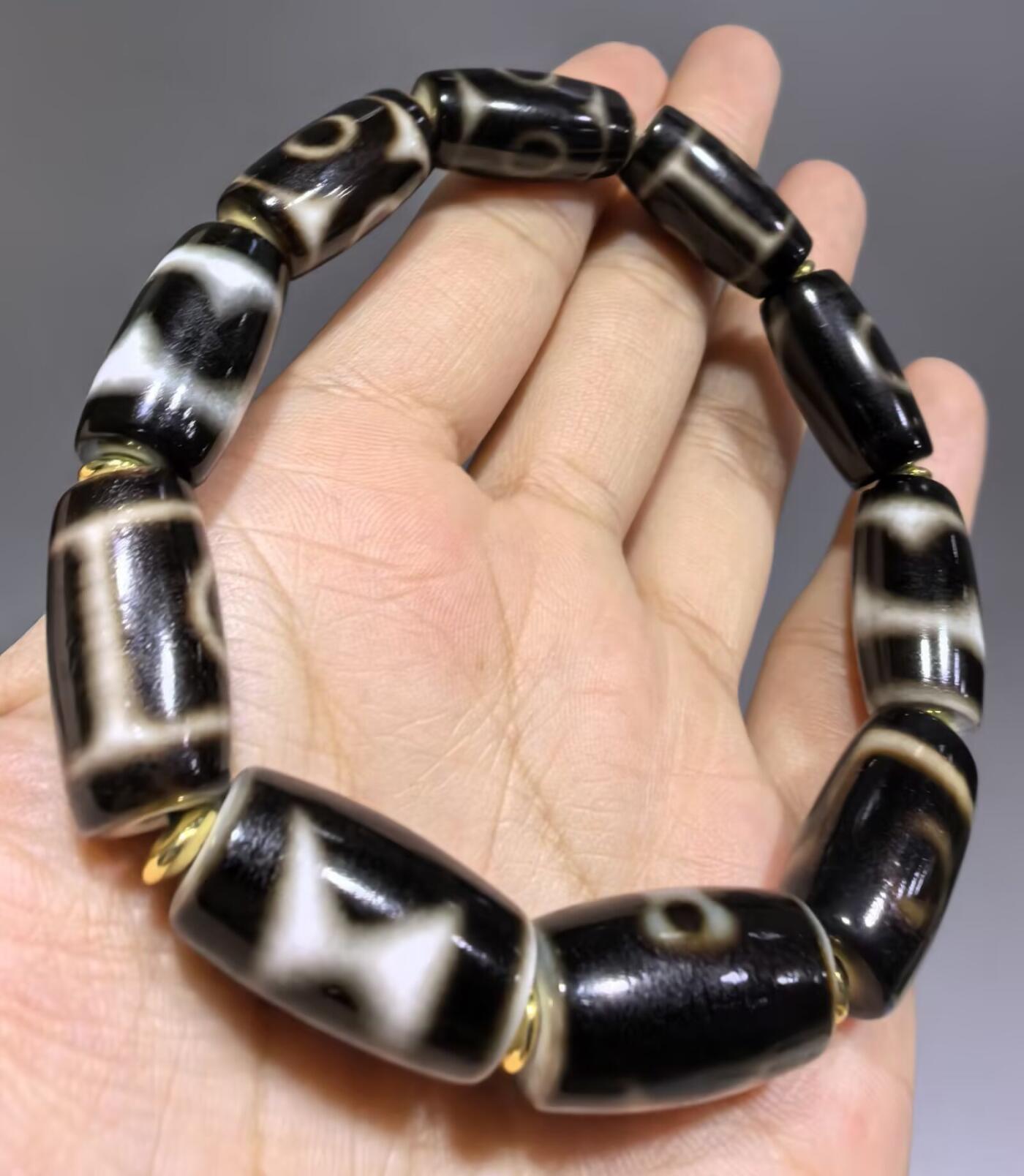 天地、三眼天珠多宝手串男款 尺寸:2.2cm*1.1cm 热门图腾，胎脂温润，晕色独特，皮壳包浆浑厚。