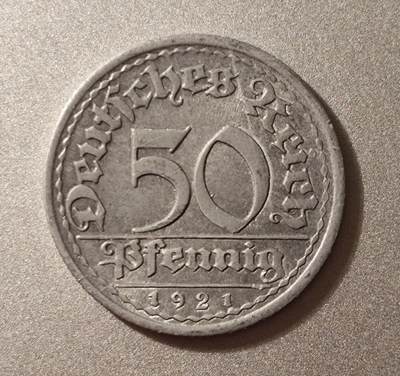 魏玛共和国时期（1921年）德国50芬尼铝币和50万马克一条的面包