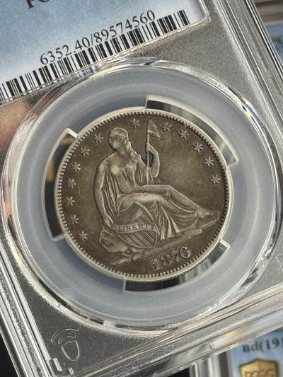 新入的美国拿旗半元，味道不错，就是脸部划痕没看到