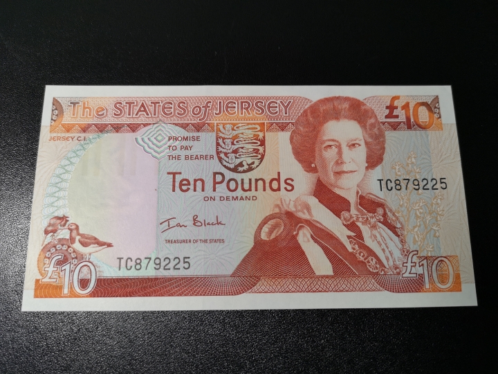 《外钞收藏家》第五十八期拍卖 泽西10镑 背面非常精美的一张  全新unc
