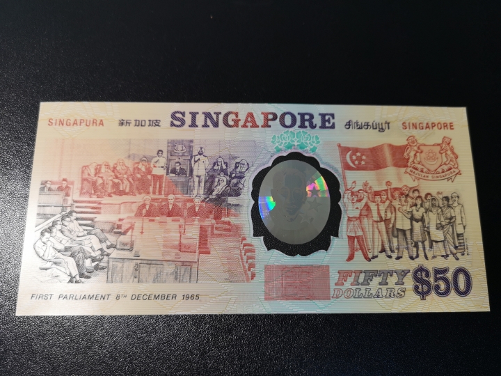 《外钞收藏家》第五十八期拍卖 新加坡1990年独立25周年塑料纪念钞  全新unc