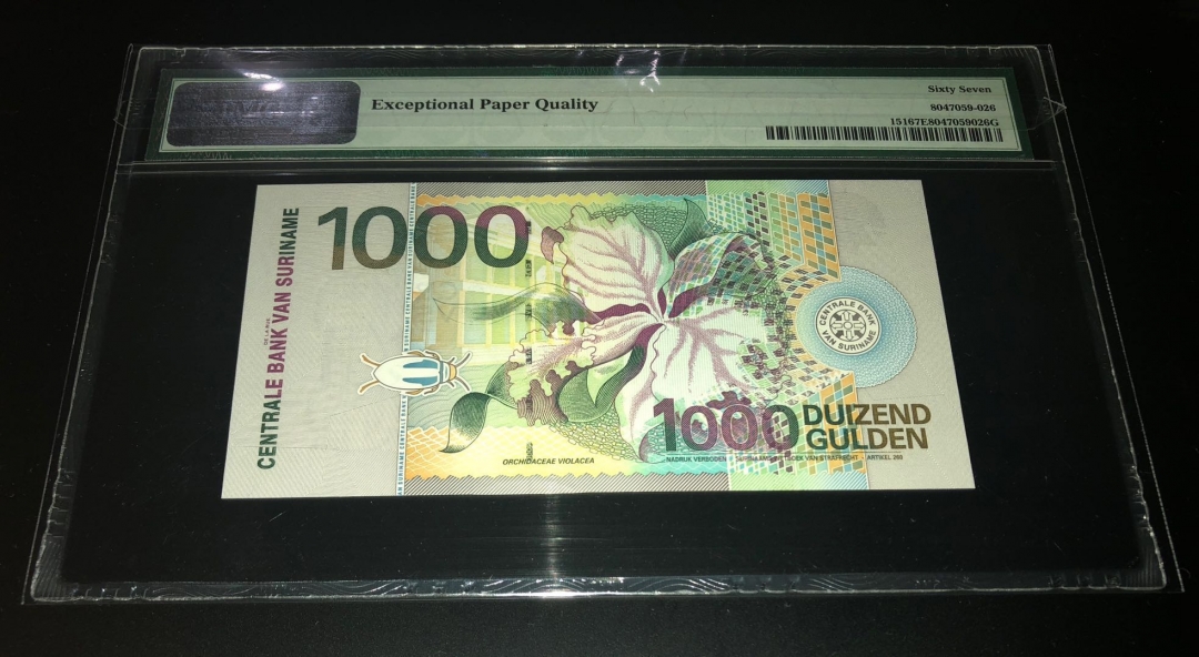 收藏联盟七十四期拍卖 苏里南001000 PMG67E