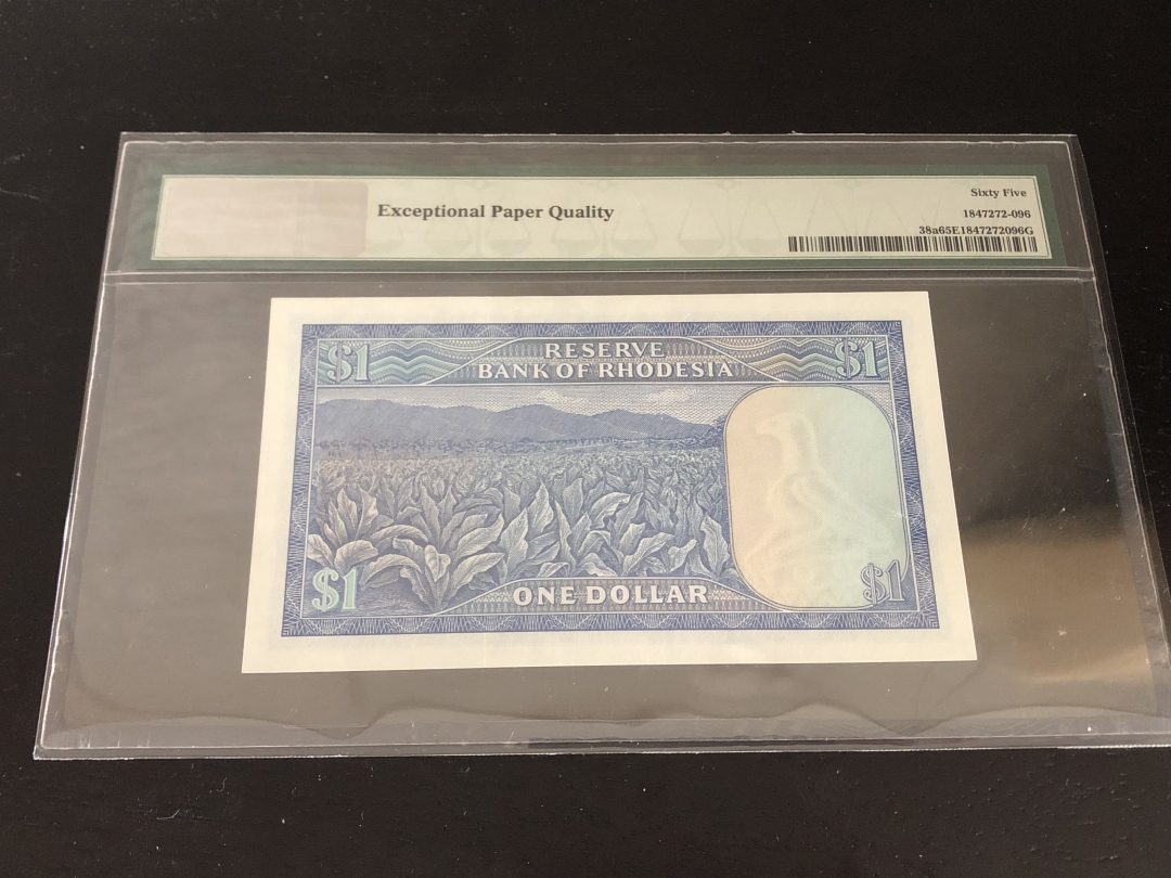收藏联盟第八十一期拍卖 罗得西亚1979年1元 PMG65E S/N:L/119 635588