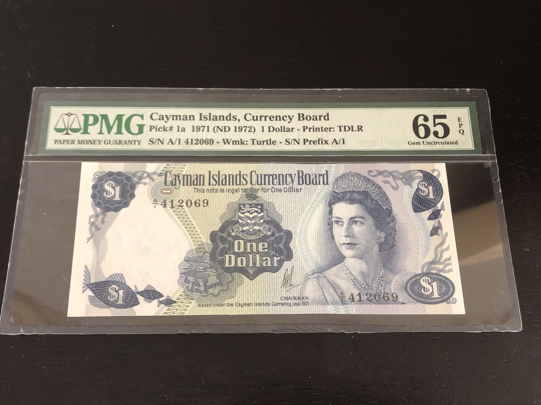收藏联盟第八十一期拍卖 开曼群岛1971年1元 PMG65E S/N:A/1 412069