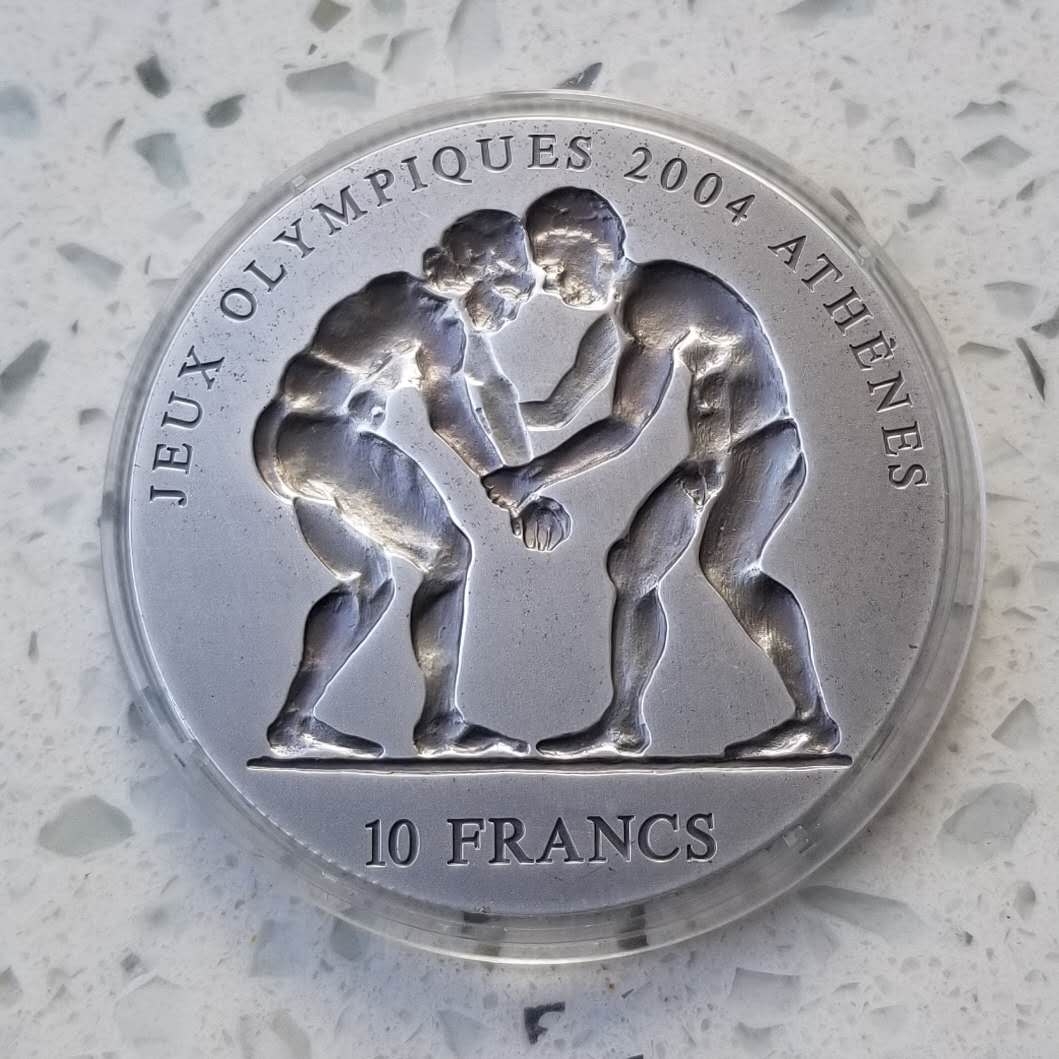 【币观天下】第六十三期拍卖 【刚果】2003年摔跤一盎司凹面仿古银币