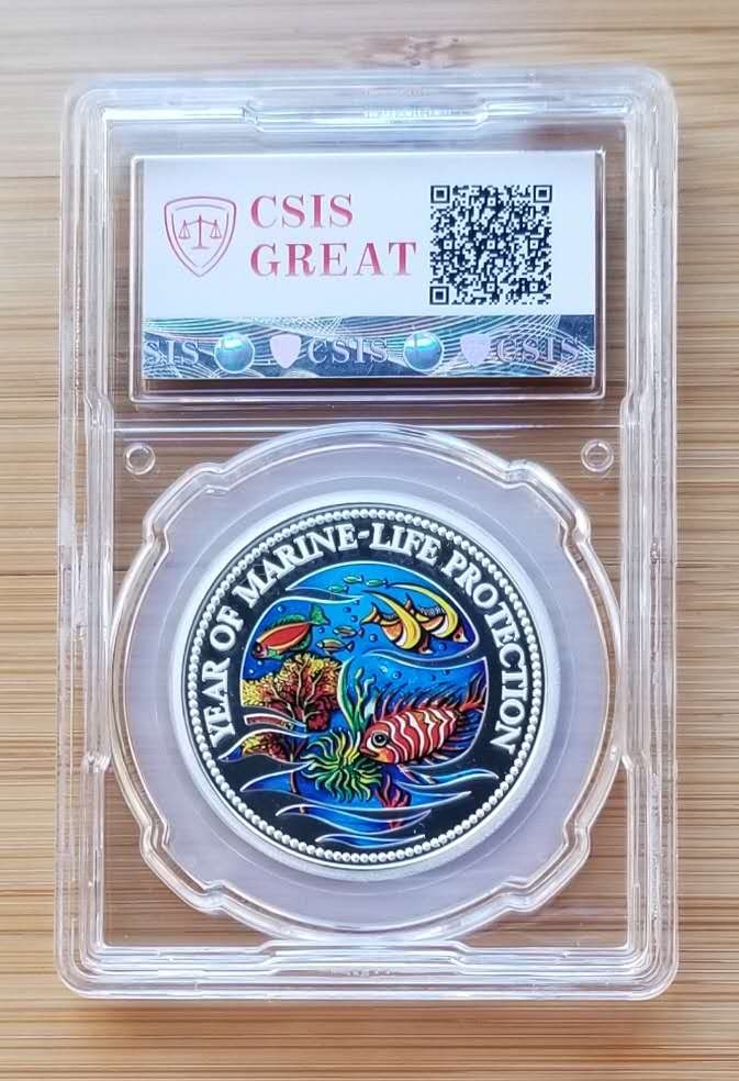 【币观天下】第六十四期拍卖 【帕劳】1992年海洋动物保护彩色纪念银币，世界上第一枚彩色纪念币，瑞士制造，信泰评级封装。