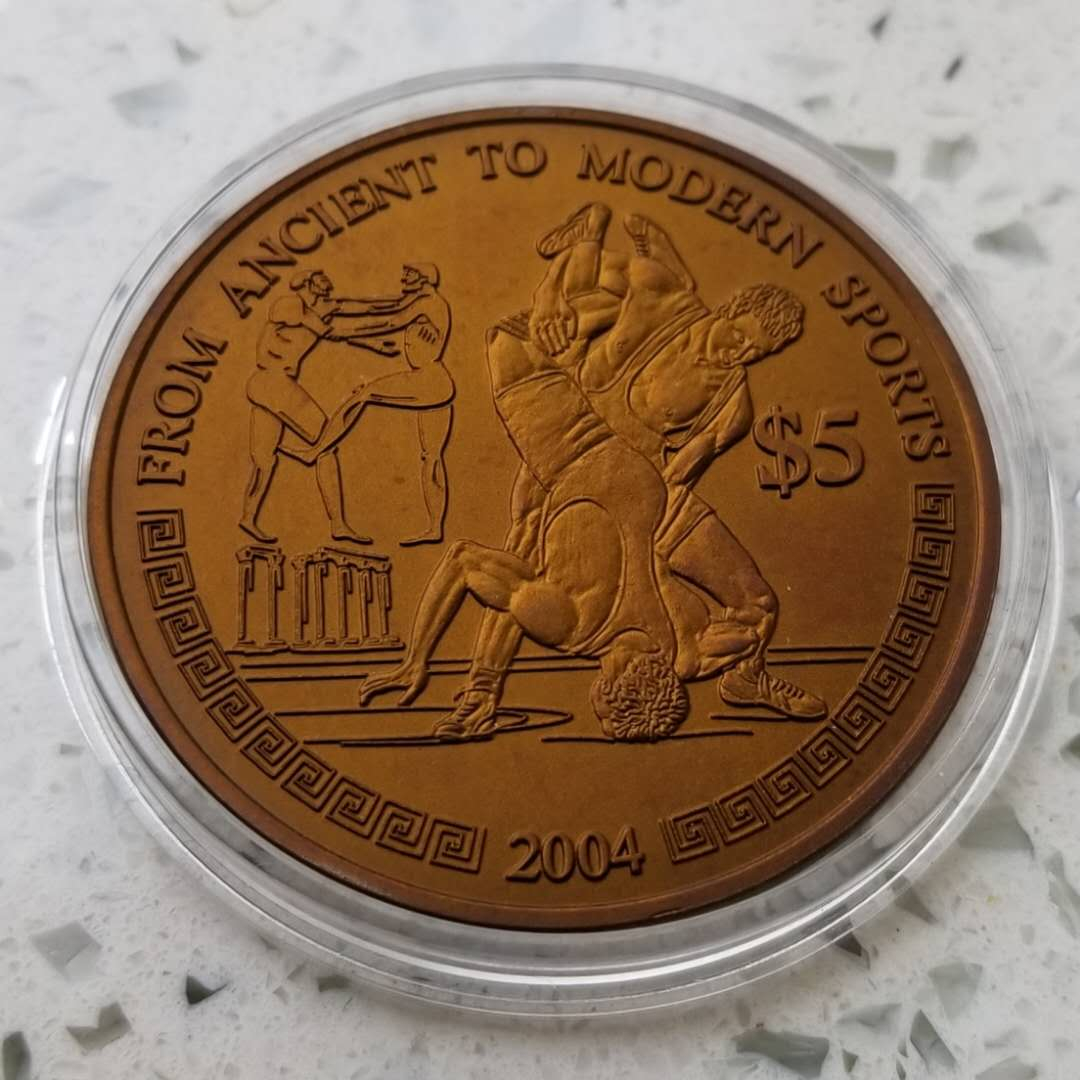 【币观天下】第六十七期拍卖 【利比里亚】2004年奥运彩色铌币一枚。