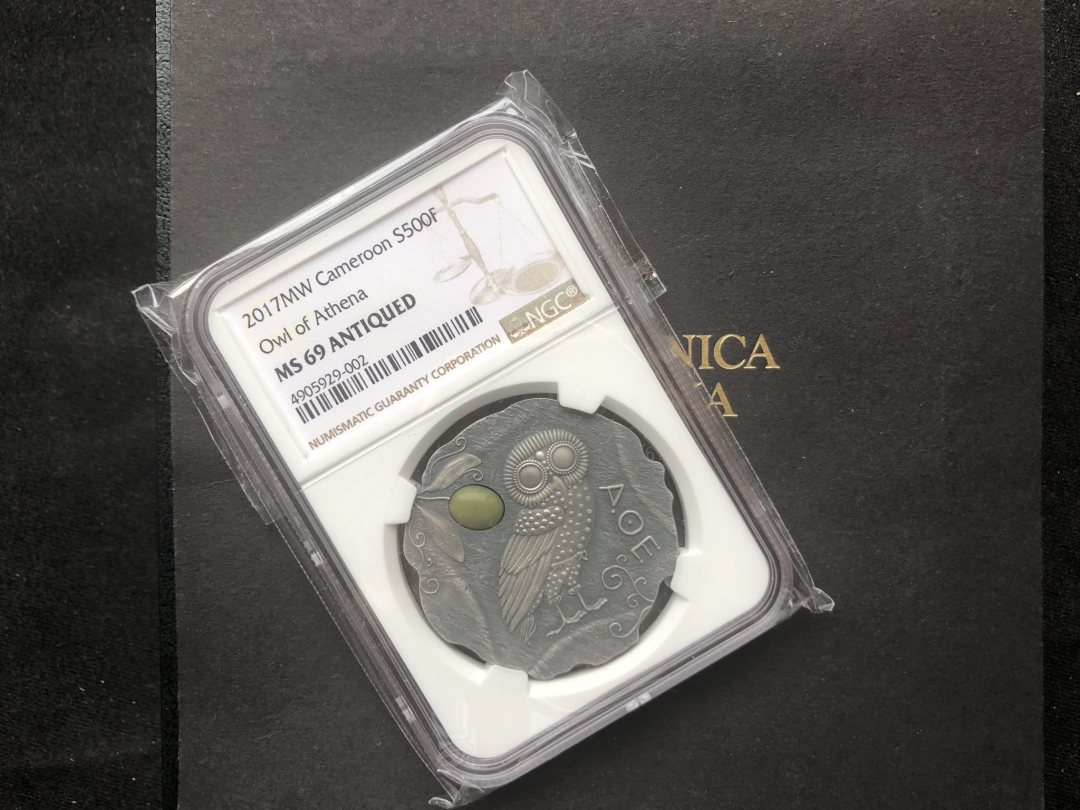 【币观天下】第六十九场拍卖 【喀麦隆】仿古镶嵌猫头鹰银币【ngc69】