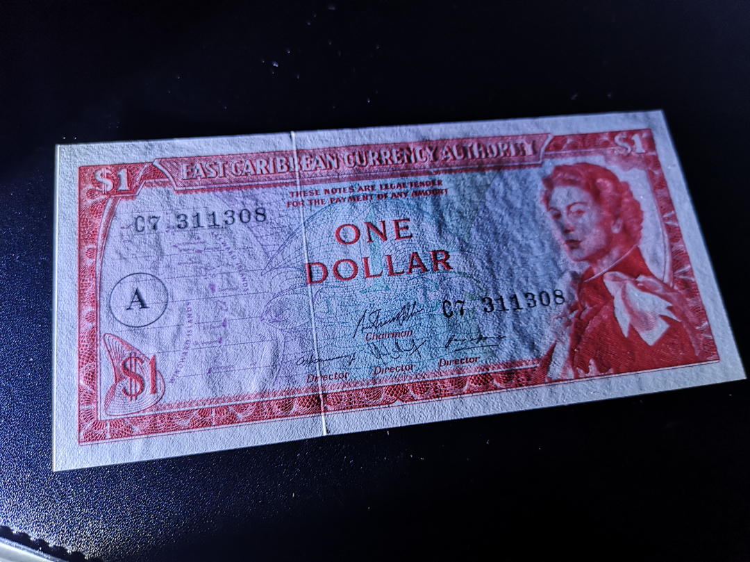 《外钞收藏家》第六十九期拍卖 东加勒比一元 精美小女王 unc