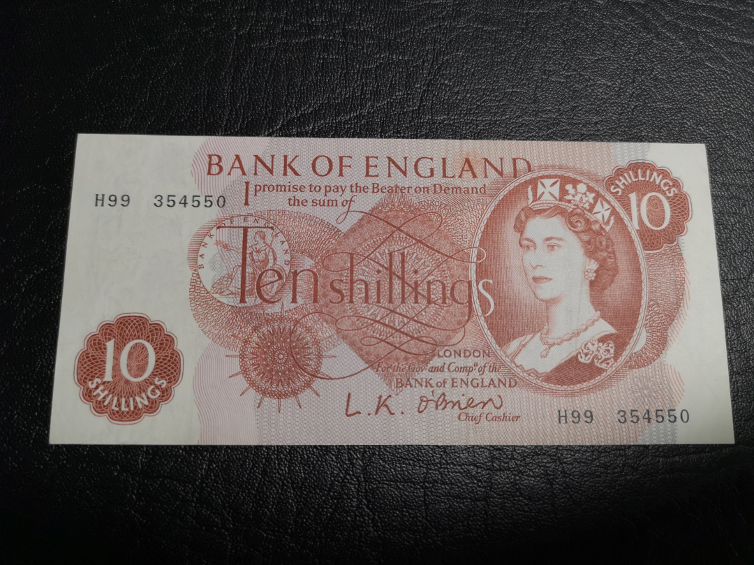 《外钞收藏家》第六十九期拍卖 巴哈马女王1元和英镑C序列10先令 VF品相两张