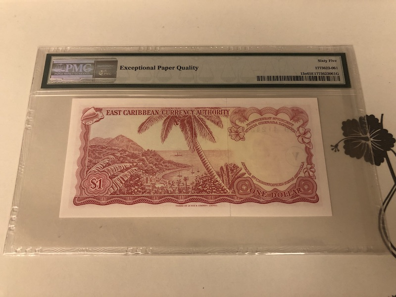 收藏联盟第九十一期拍卖 1965年东加勒比1元戎装女王 PMG65E S/N:C9 412431