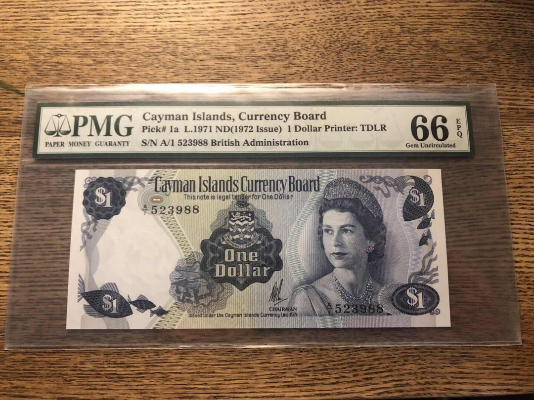 收藏联盟第九十三期拍卖 1971年开曼岛1元 首发冠无47尾88 PMG66E