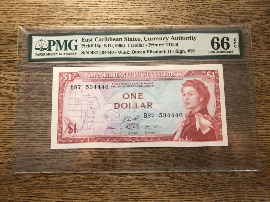 收藏联盟第九十三期拍卖 1965年东加勒比1元戎装女王 PMG66E