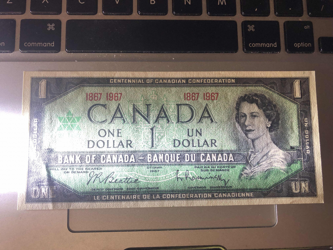 收藏联盟第九十四期拍卖 1967年加拿大100周年纪念钞1元 UNC-角有软折