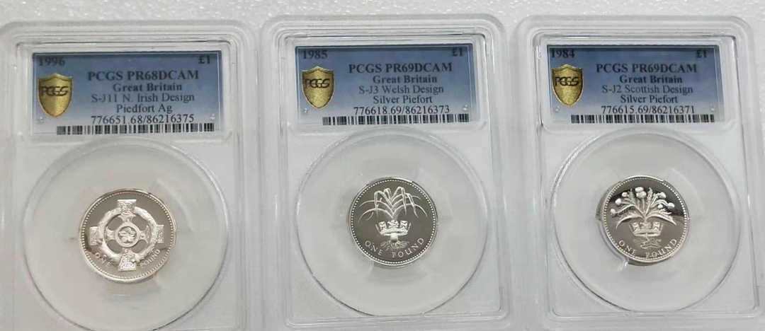 小魏钱币第29期中外金银币专场 PCGS PR69 68英国1镑精制银币3枚 1984，1985，1996年 加厚1镑银币3枚 加厚盒，每一枚重19克925银 共57克银