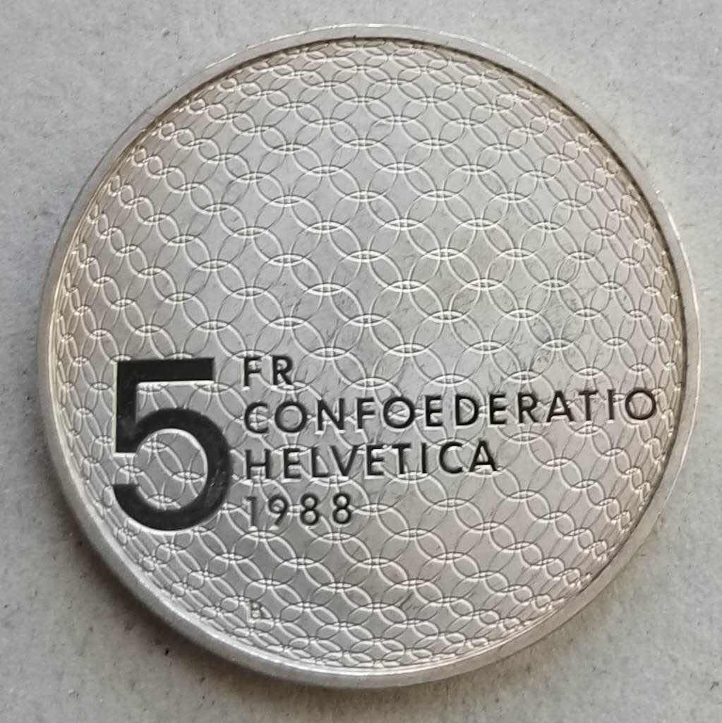 【币观天下】第八十四期钱币拍卖 克劳斯获奖币瑞士1988年奥运五环5法郎纪念币