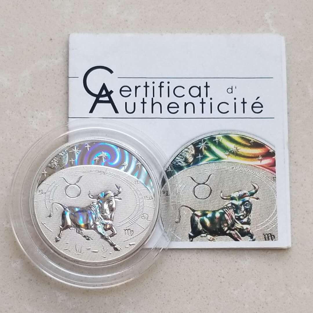 【币观天下】第八十六期钱币拍卖 喀麦隆2010年金牛座幻彩银币，1/2盎司