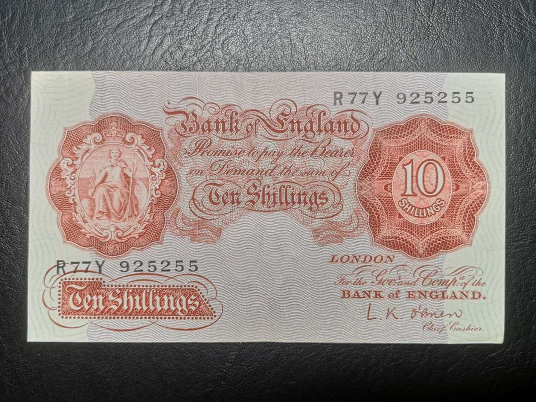 《外钞收藏家》第七十二期拍卖 英国A序列1镑 au品相 无折 角不尖 10先令xf两张一起