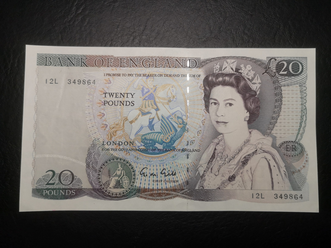 《外钞收藏家》第七十二期拍卖 英国D序列20镑 unc-有一道压痕 其他不错