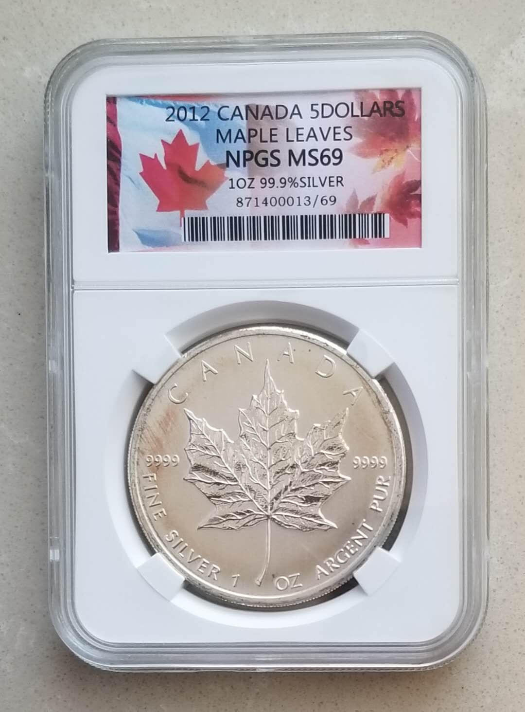 【币观天下】第九十七期钱币拍卖 加拿大投资币2012年枫叶1盎司银币，有氧化