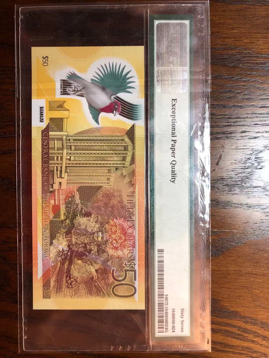 【鲸贝乐淘】千字文·第“遐迩一体”号拍卖 世界最佳获奖钞，特立尼达和多巴哥🇹🇹2014年50元塑料钞，cb首冠，pmg67