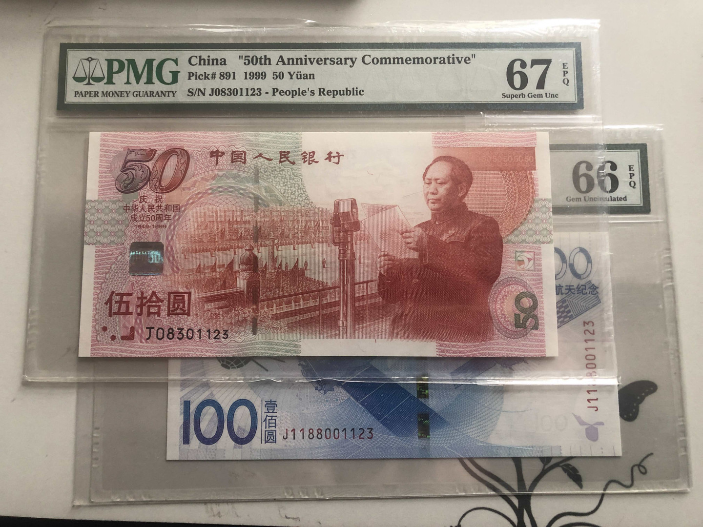 【收藏联盟】第127期拍卖——花神迎春（共50拍） 【一组2张01123尾同】新中国成立50周年纪念钞 PMG67EPQ &航天纪念钞 2015年 100元 PMG66EPQ