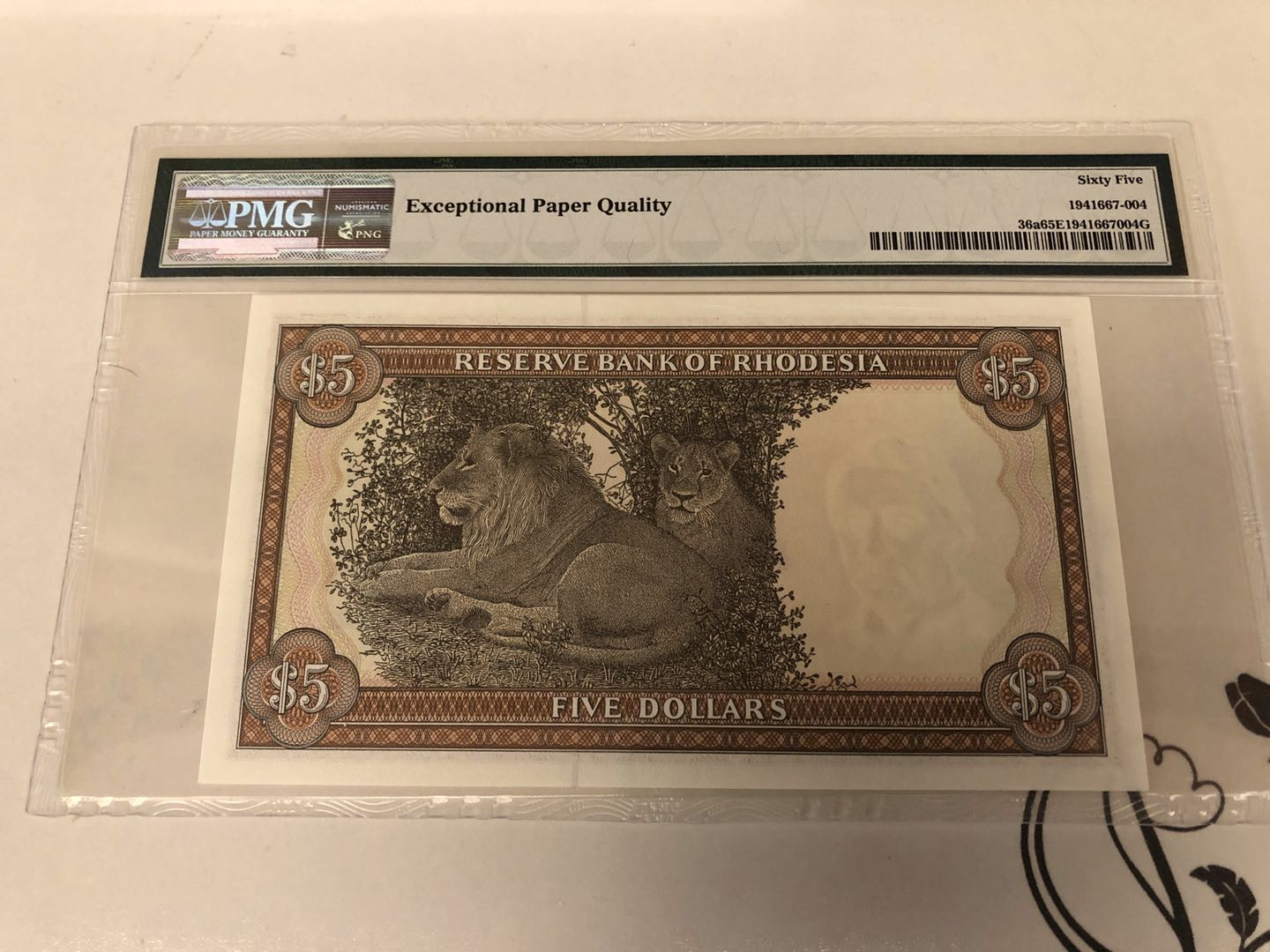 【收藏联盟】第128期拍卖——北爱遗珍（共50拍） 罗德西亚1978年5元 P-36a  PMG65EPQ  狮子王