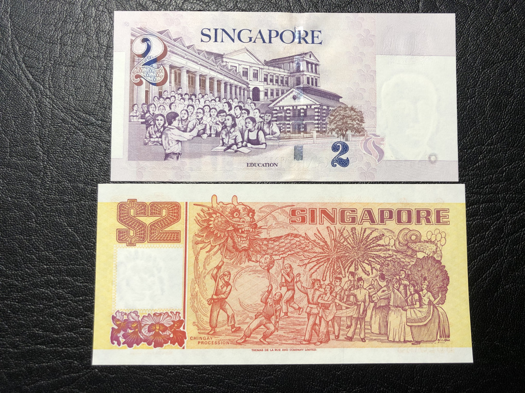 《外钞收藏家》第七十七期拍卖 新加坡船版2元、塑料钞2元 全新品相