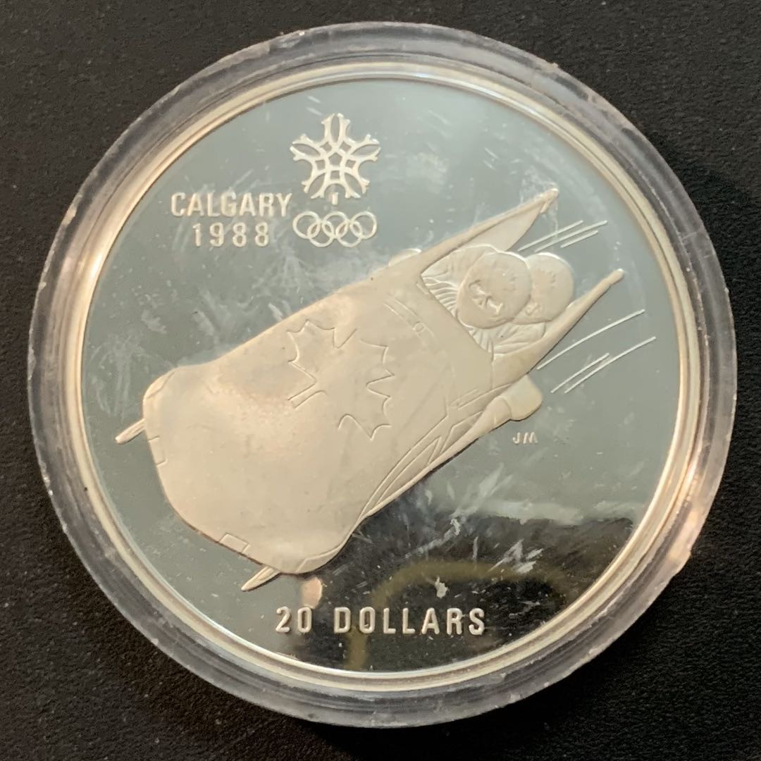紫瑗钱币—微拍第46期  加拿大 1987年 卡尔加里冬奥会 速滑车 20元  34.1克 0.925银 精制
