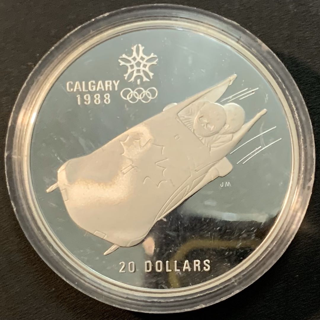紫瑗钱币—微拍第53期  加拿大 1987年 卡尔加里冬奥会 速滑车 20元  34.1克 0.925银 精制