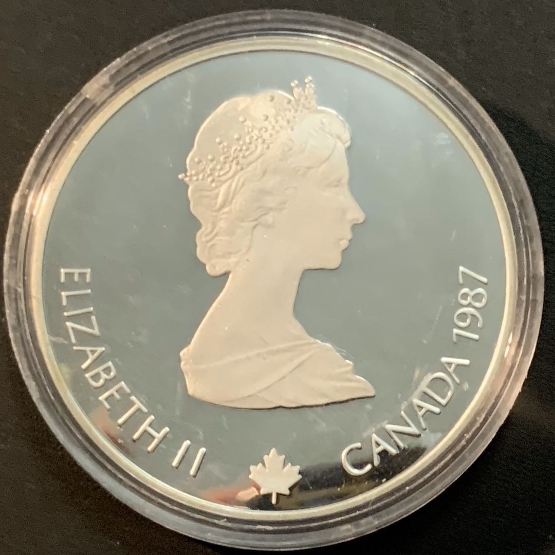 紫瑗钱币—微拍第53期  加拿大 1987年 卡尔加里冬奥会 速滑车 20元  34.1克 0.925银 精制