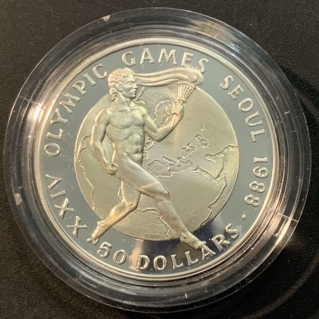 紫瑗钱币—微拍第56期  库克群岛 1987年 88汉城奥运会 火炬 50元 28.28克 0.925银 精制