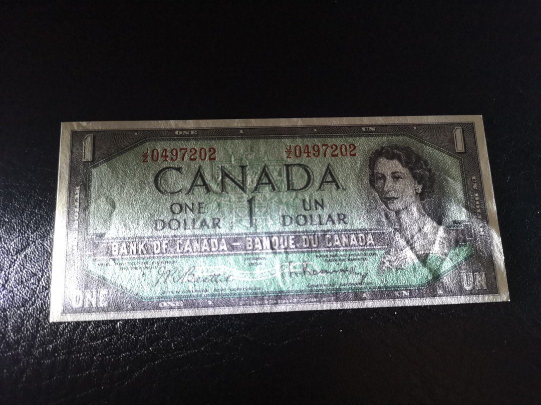 《外钞收藏家》第八十期拍卖 加拿大1954年1加元 背面雕刻细腻  全新unc 常见点钞痕