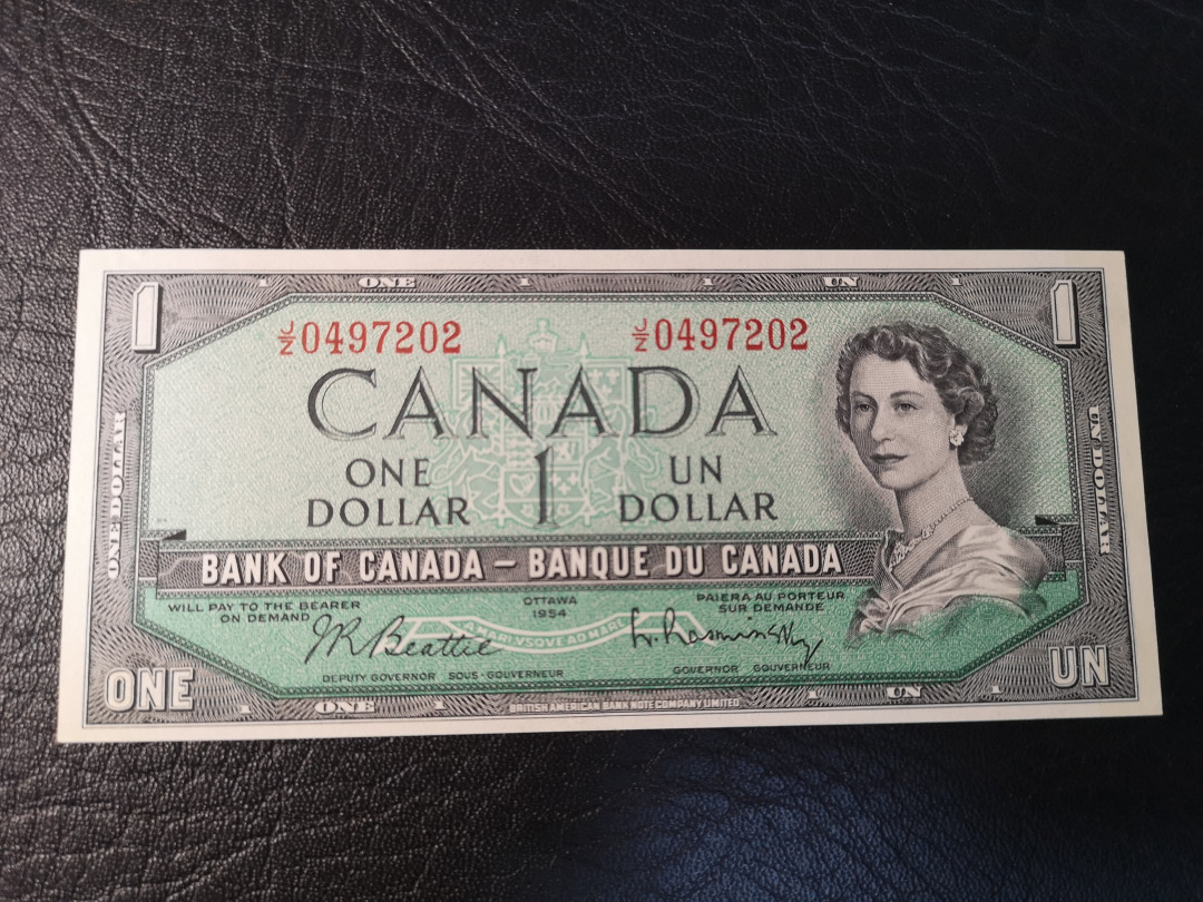 《外钞收藏家》第八十期拍卖 加拿大1954年1加元 背面雕刻细腻  全新unc 常见点钞痕