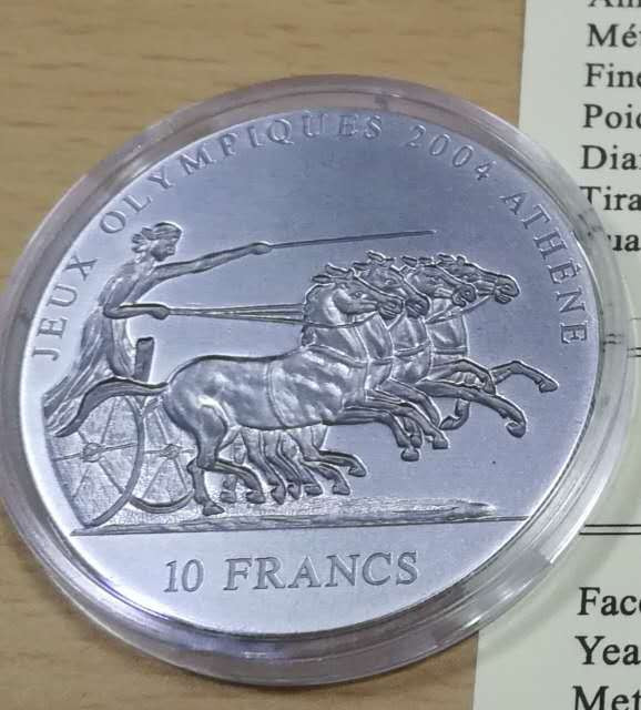 北京马甸外币专卖拍卖第十一期，陆续上新，欢迎关注 2001年刚果加纳古代太阳神马车凹凸银币。每枚重1盎司，999银，品相如图