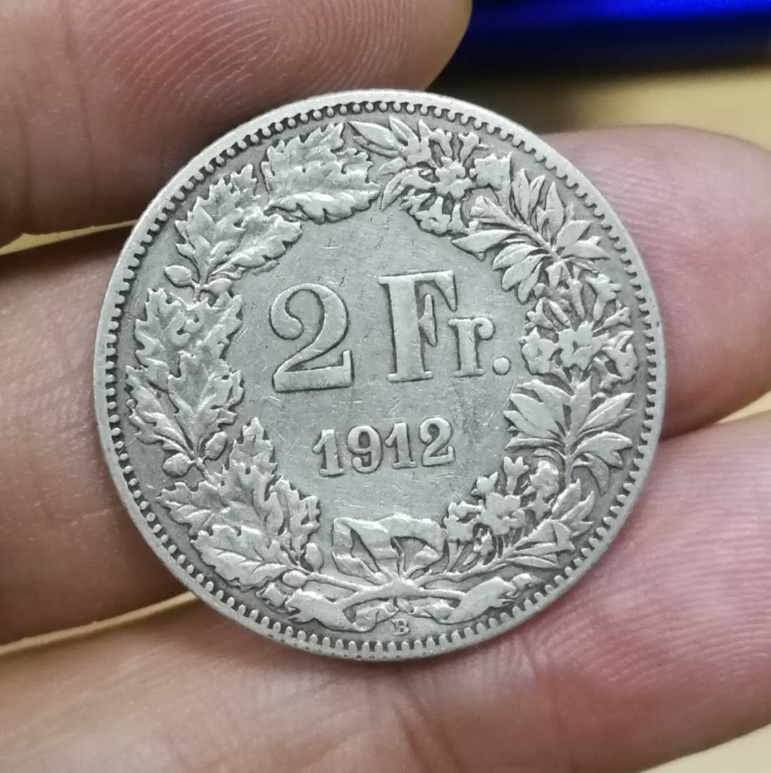 北京马甸外币专卖拍卖第十三期，陆续上新欢迎关注 1912年瑞士2法郎银币，重10克，835银，品相如图