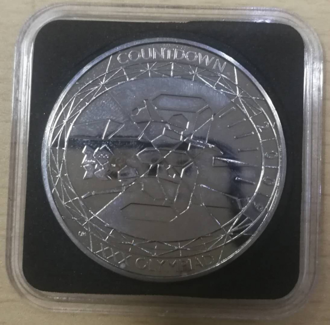 北京马甸外币专卖拍卖第十四期，非贵金属硬币专场，陆续上新，欢迎关注 2009年英国伦敦奥运会倒计时5镑纪念币，品相如图