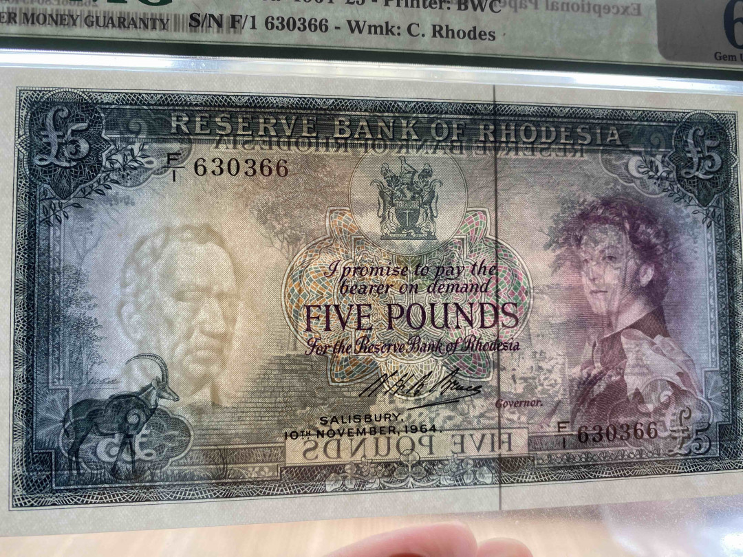 【收藏联盟】第154期拍卖——大津巴布韦遗址（共50拍） 罗德西亚 1964年 5镑无47 PMG66EPQ  p26a 戎装女王 大津巴布韦遗址 BWC出品