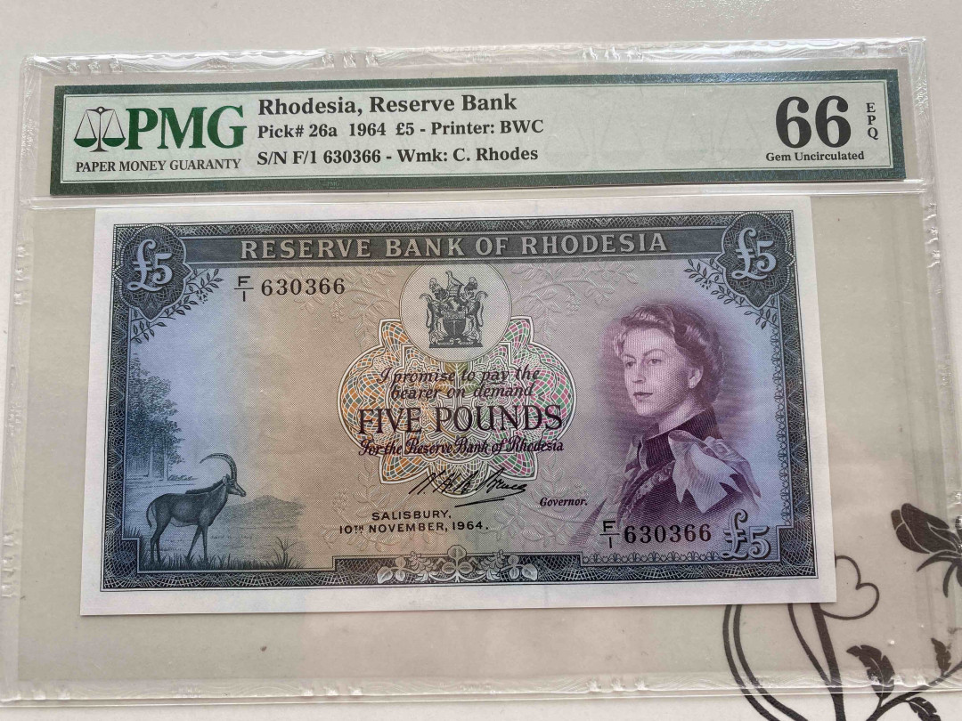 【收藏联盟】第154期拍卖——大津巴布韦遗址（共50拍） 罗德西亚 1964年 5镑无47 PMG66EPQ  p26a 戎装女王 大津巴布韦遗址 BWC出品