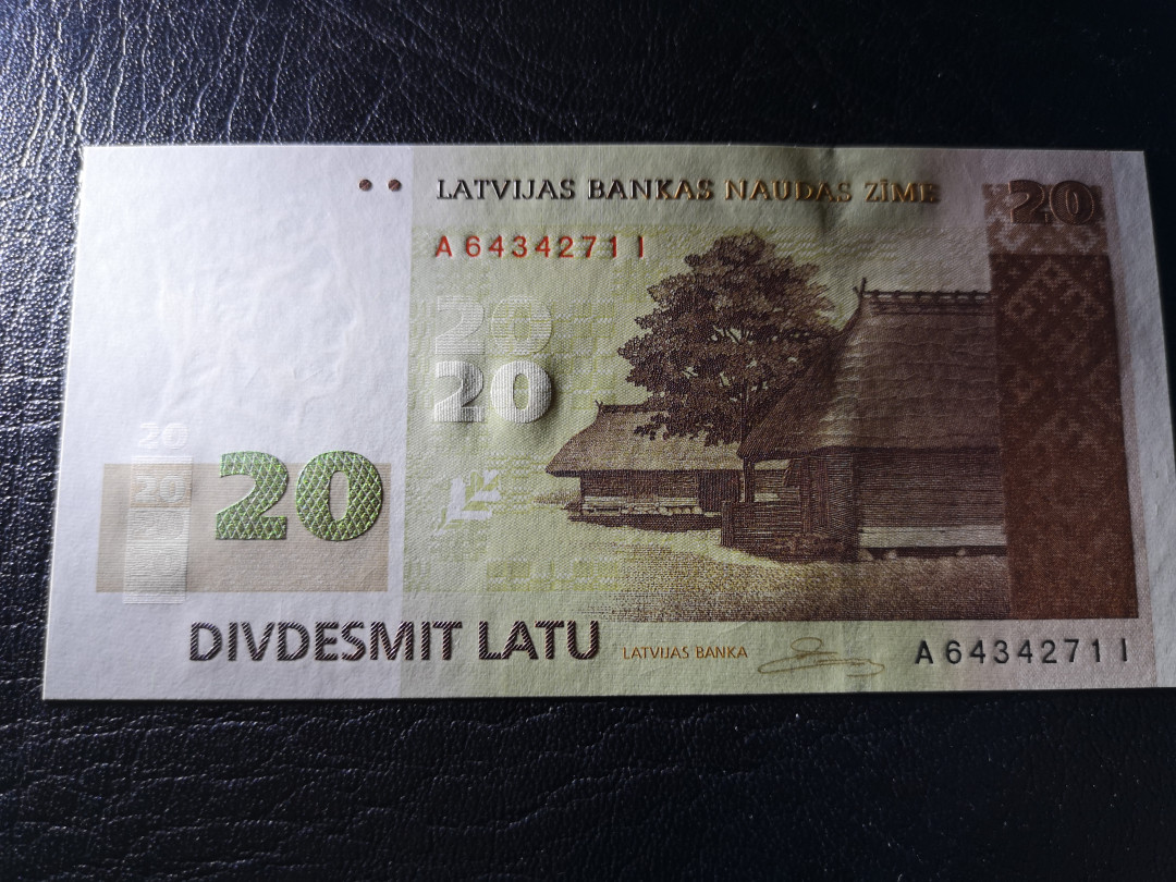 《外钞收藏家》第八十一期拍卖 拉脱维亚2009年20  A冠 非常精美的小票 全新unc