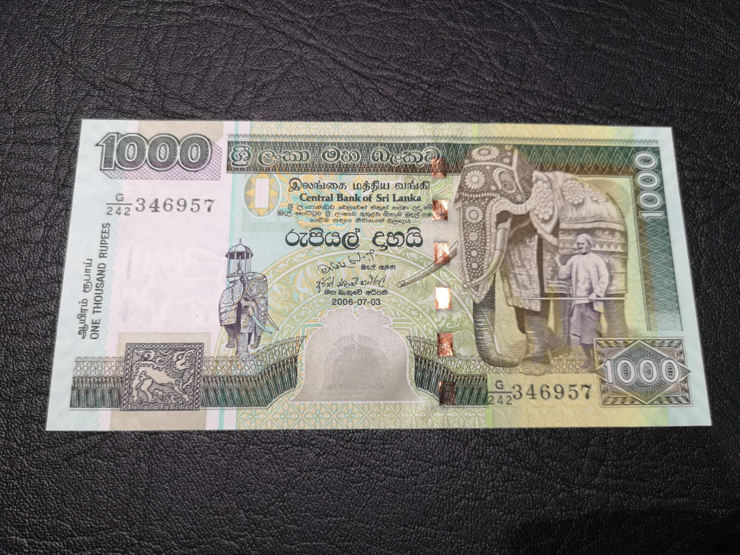 《外钞收藏家》第八十一期拍卖 斯里兰卡2006年1000  孔雀钞 全新unc