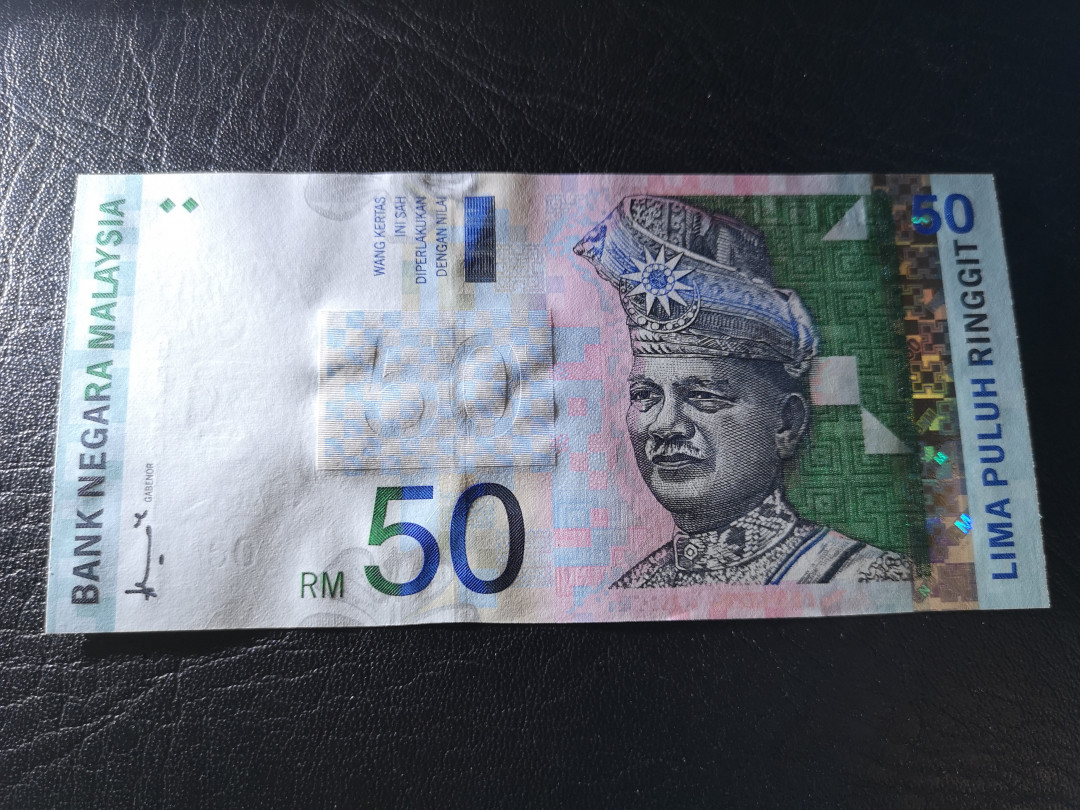 《外钞收藏家》第八十一期拍卖 马拉西亚林吉特50  全新unc 非常精美的一版纸币