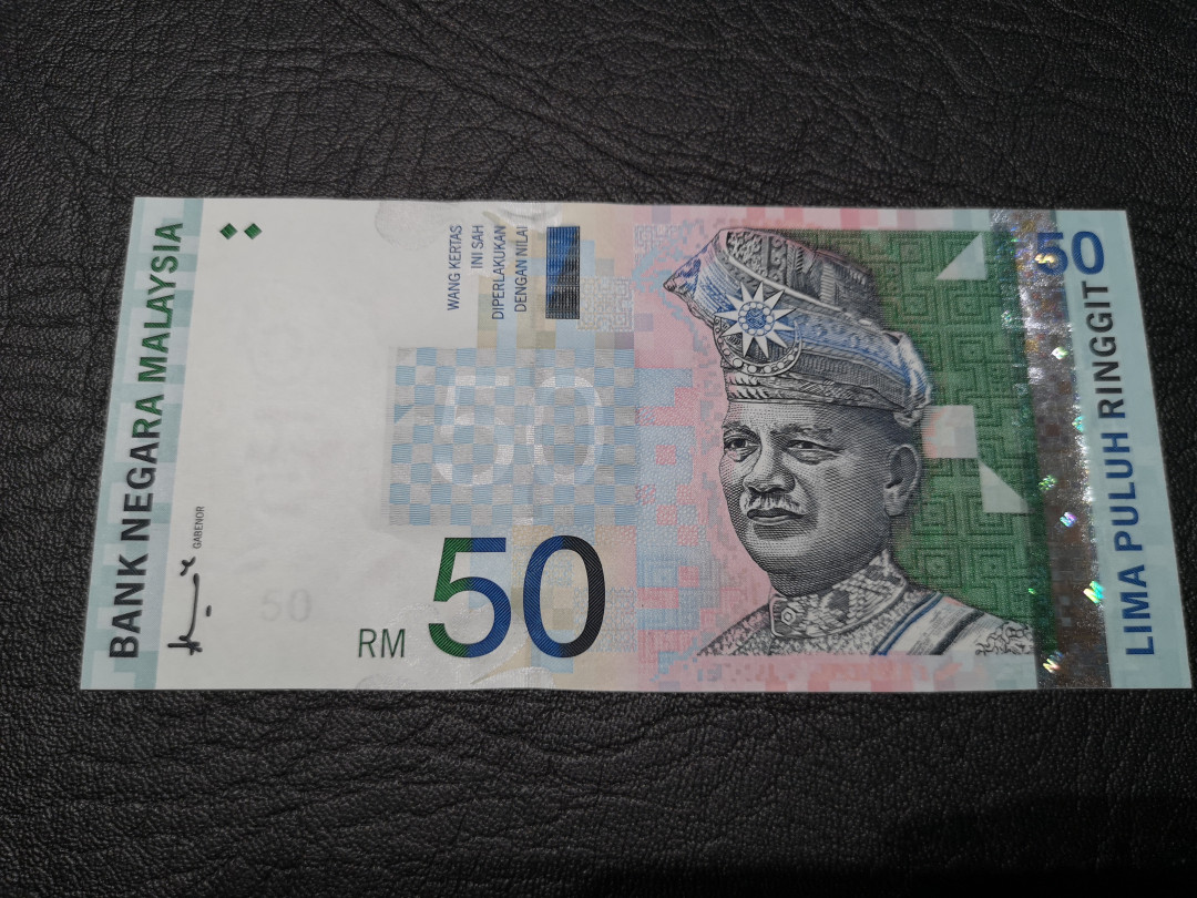 《外钞收藏家》第八十一期拍卖 马拉西亚林吉特50  全新unc 非常精美的一版纸币