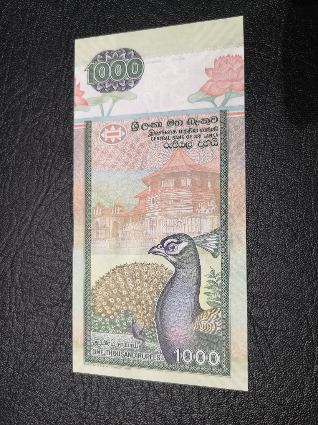 《外钞收藏家》第八十一期拍卖 斯里兰卡2006年1000  孔雀钞 全新unc