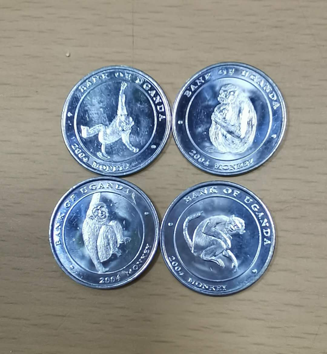 北京马甸外币专卖微拍第二十二期，非贵金属纪念币，流通币专场。陆续上新，欢迎关注陆续上新 乌干达猴子纪念币4枚，品相如图