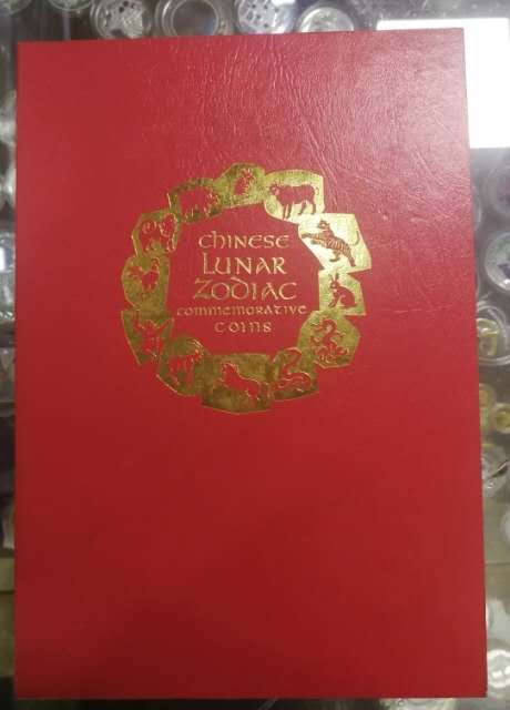 北京马甸外币专卖微拍第二十四期，非贵金属纪念币，流通币专场，陆续上新，欢迎关注 2000年利比里亚发行中国12生肖纪念币册，品相如图