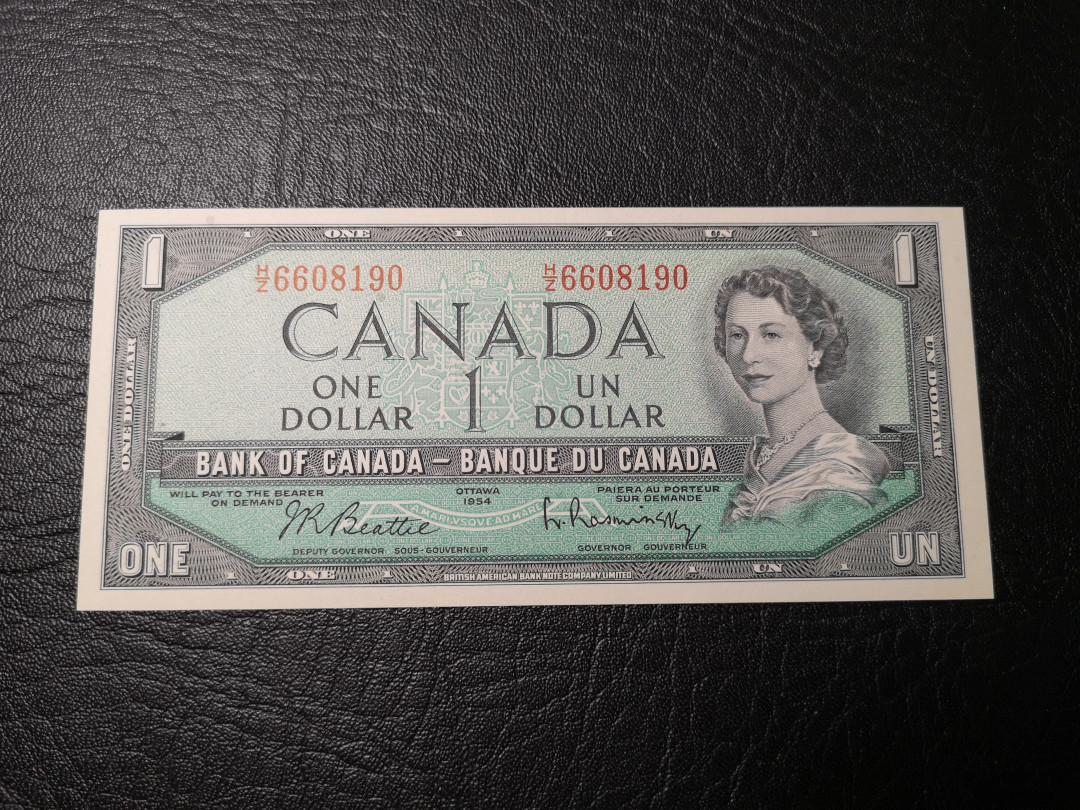 《外钞收藏家》第八十五期拍卖 1954年加拿大1加元 全新品相  背面风景雕刻精细 漂亮
