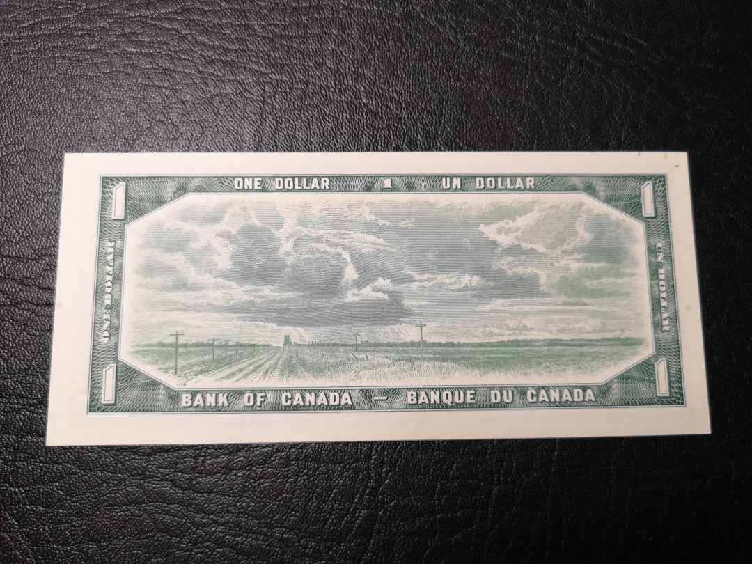 《外钞收藏家》第八十五期拍卖 1954年加拿大1加元 全新品相  背面风景雕刻精细 漂亮