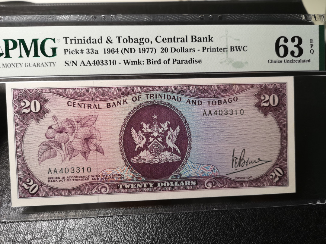 《外钞收藏家》第八十七期拍卖 特里达尼亚和多巴哥 AA冠 BWC版 20刀 pmg63